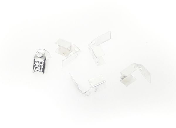 МЕТАЛНИ ЕЛЕМЕНТИ - НАКРАЙНИК ДВОЕН СЪС ЗЪБИ - 5х9мм СРЕБРИСТО - ПАКЕТ 1000 бр. Отвор-1.0мм